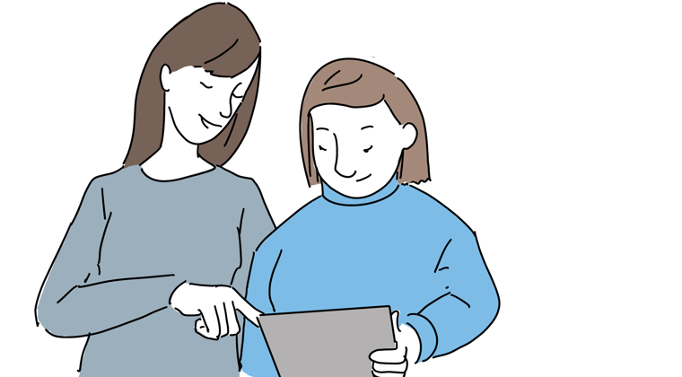 En konsulent hjælper med støttende teknologi på en iPad. 